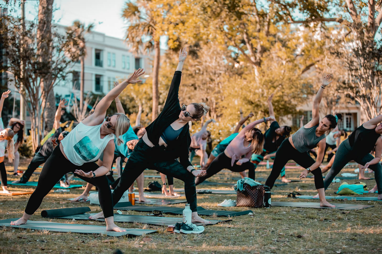 People doing yoga outside