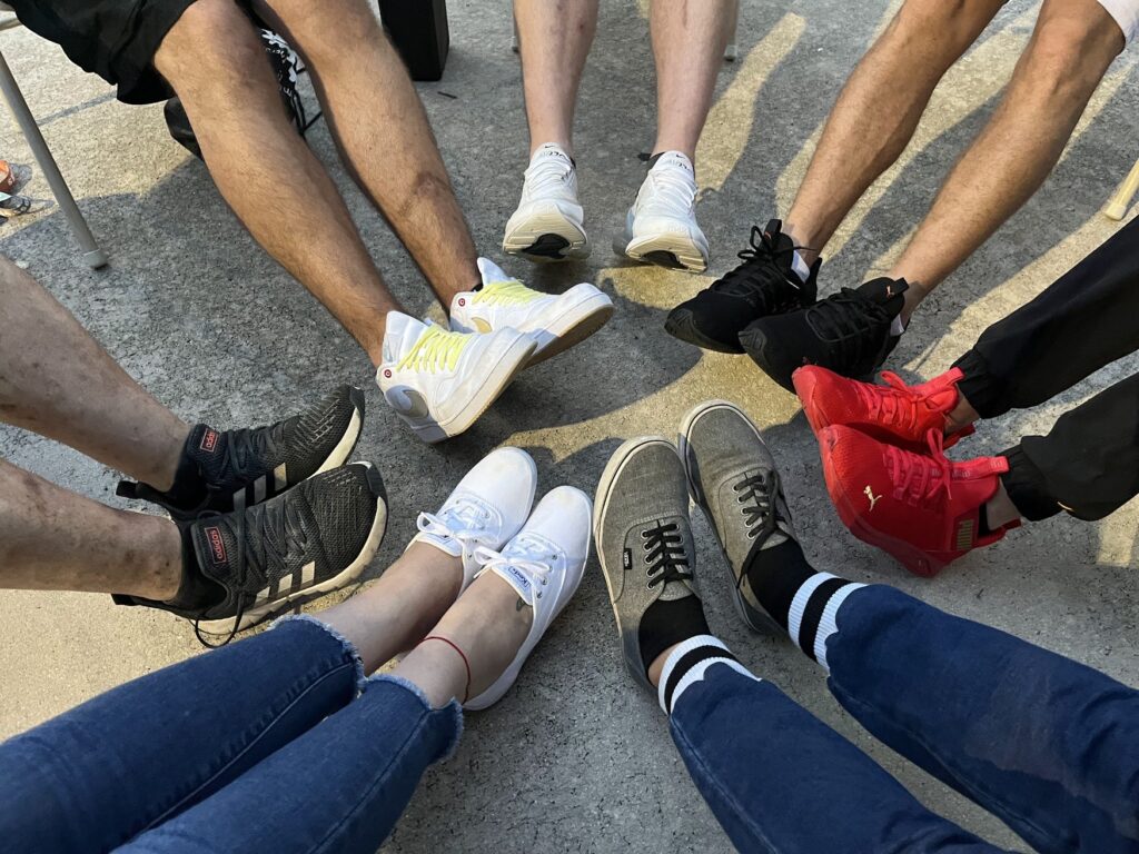 Picture of peoples shoes in a circle